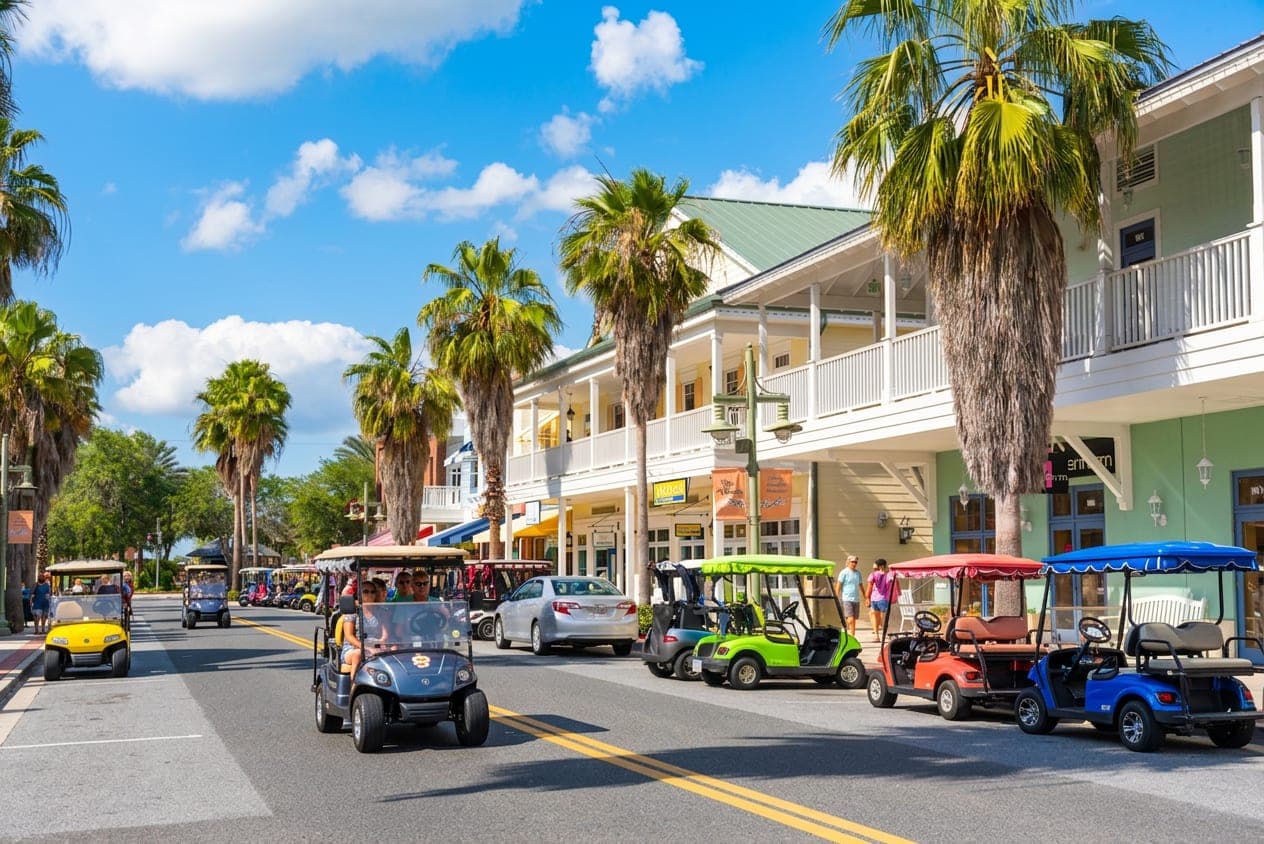 Golf carts and storefronts on a town square street in The Villages